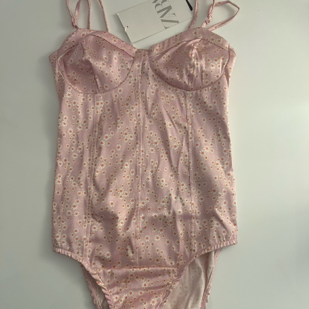 Zara, size small/26, runs a bit small, has adjustable straps, brand new with tag